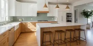 Bright contemporary kitchen in an Englewood-area home with a central island and warm wood cabinetry